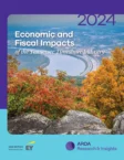 Cover of a report titled "2024 Economic and Fiscal Impacts of the Tennessee Timeshare Industry," featuring a scenic view of a river, rocky cliffs, and autumn foliage.